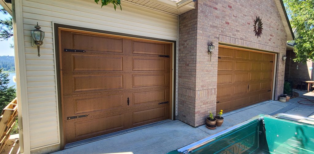 large garage with two wood panel style custom garage doors